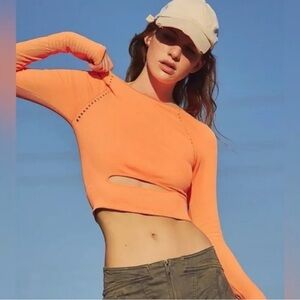 FP movement Women's Neon Orange Long Sleeve Crop Top